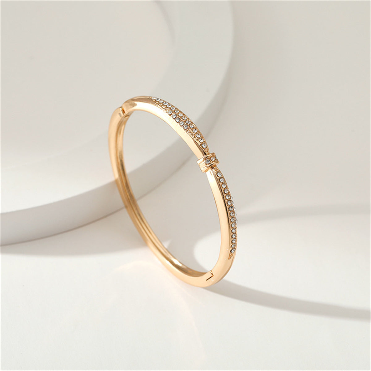 Cubic Zirconia and 18K Gold-Plated Knot Bangle, gold bangle bracelet, vintage-inspired design, detail close-up