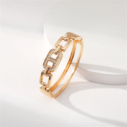 Clear Cubic Zirconia and 18K Gold-Plated Oval Charm Bangle, gold bangle bracelet, elegant gift for her, detail close-up
