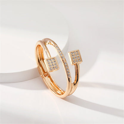 Clear Cubic Zirconia and 18K Gold-Plated Square Hinged Bypass Bangle, gold bangle bracelet, detail close-up