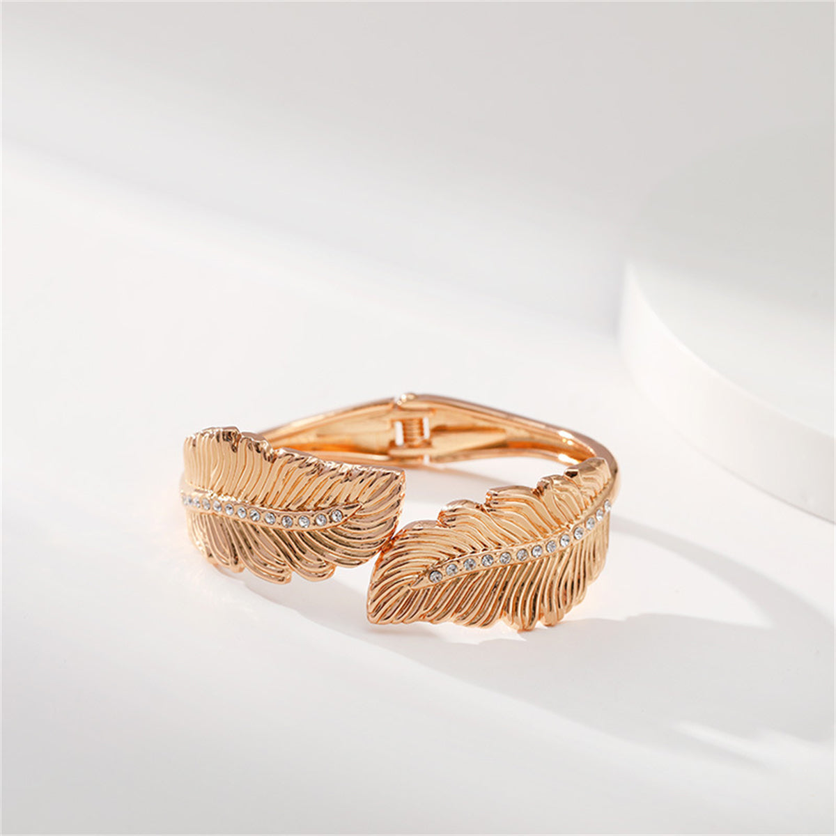 Clear Cubic Zirconia and 18K Gold-Plated Leaf Hinged Bypass Bangle, gold bangle bracelet, vintage-inspired design, side view