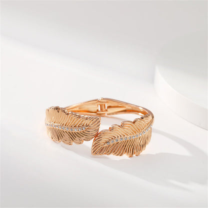 Clear Cubic Zirconia and 18K Gold-Plated Leaf Hinged Bypass Bangle, gold bangle bracelet, vintage-inspired design, side view