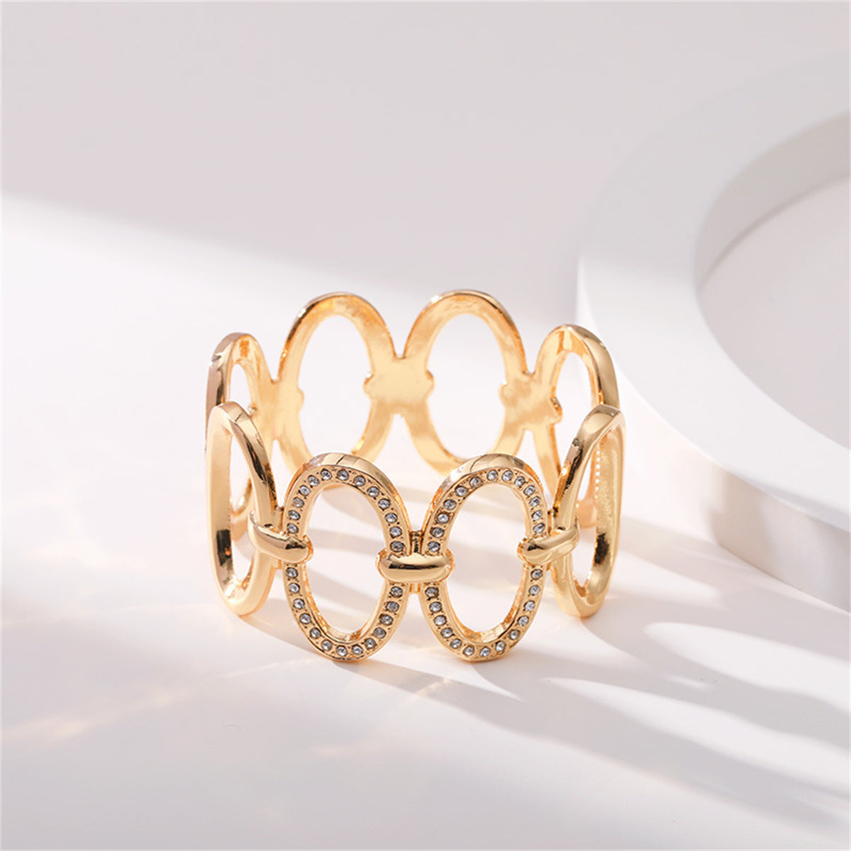 Clear Cubic Zirconia and 18K Gold-Plated Oval Station Bangle, gold bangle bracelet, botanical inspired, detail close-up