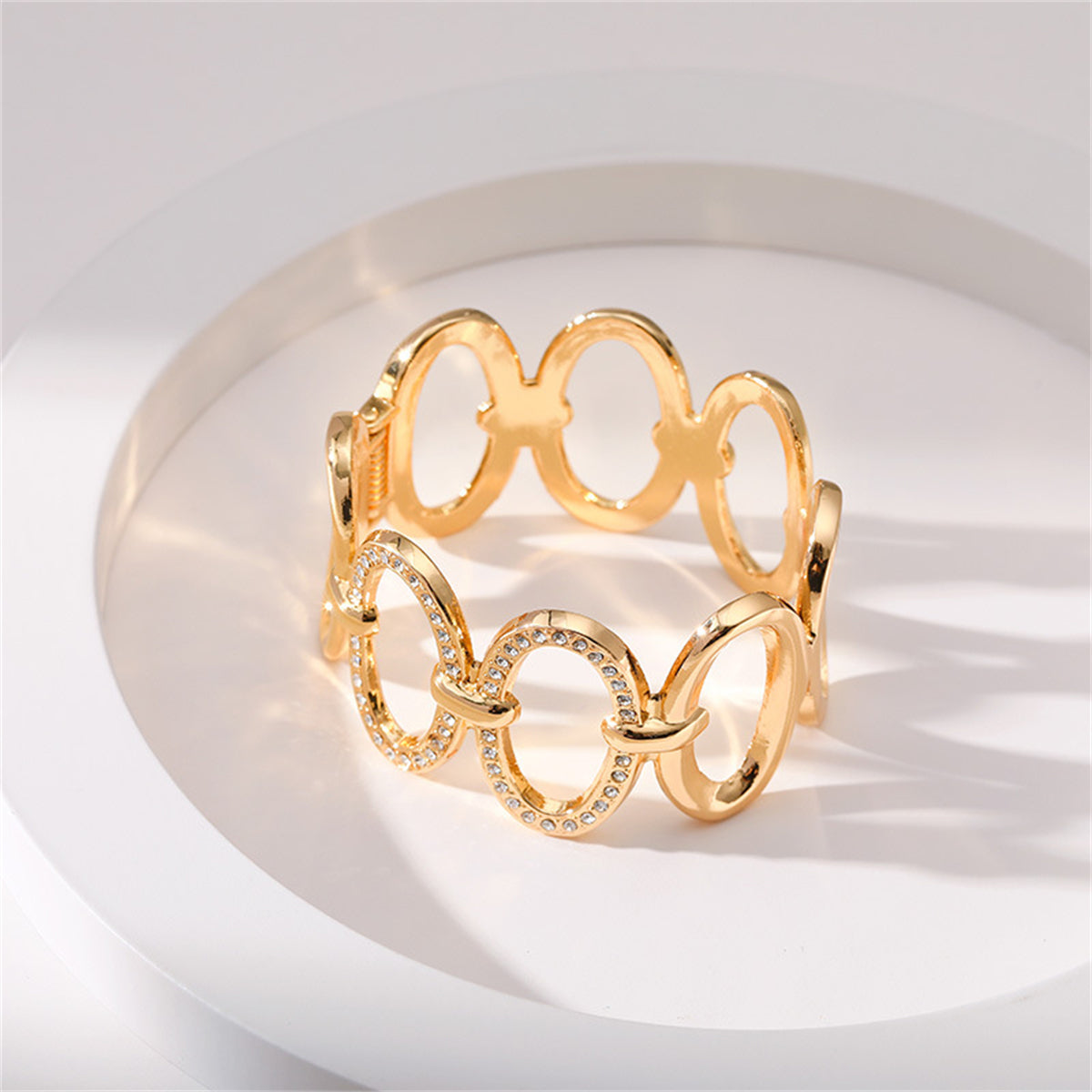 Clear Cubic Zirconia and 18K Gold-Plated Oval Station Bangle, gold bangle bracelet, botanical inspired, side view