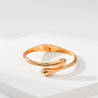 Cubic Zirconia and 18K Gold-Plated Double Snakes Hinge Bypass Bangle, gold bangle bracelet, detail close-up