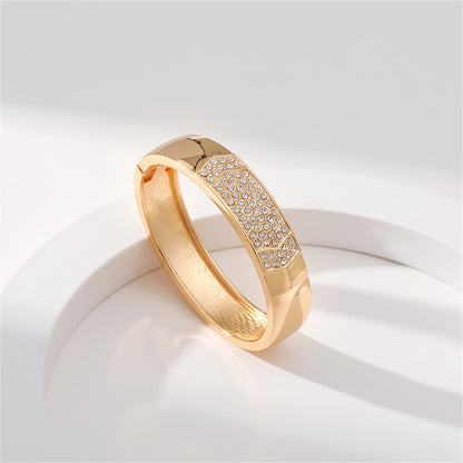 Cubic Zirconia and 18K Gold-Plated Arrow Bangle, gold bangle bracelet, vintage-inspired design, side view
