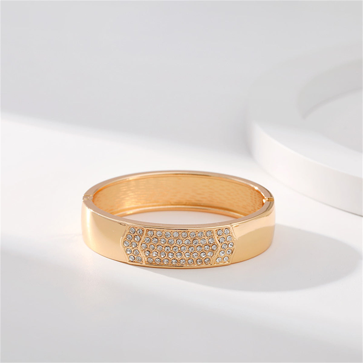Cubic Zirconia and 18K Gold-Plated Arrow Bangle, gold bangle bracelet, vintage-inspired design, detail close-up