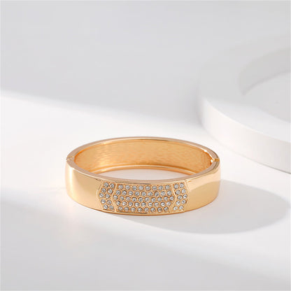 Cubic Zirconia and 18K Gold-Plated Arrow Bangle, gold bangle bracelet, vintage-inspired design, detail close-up
