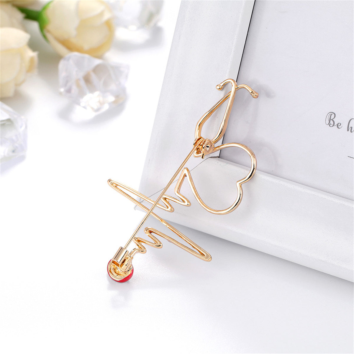 Cubic Zirconia and Enamel 18K Gold-Plated Stethoscope Heartbeat Brooch, gold brooch pin, detail close-up