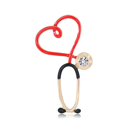 Cubic Zirconia and Enamel 18K Gold-Plated Stethoscope Brooch, gold brooch pin, botanical inspired, front view