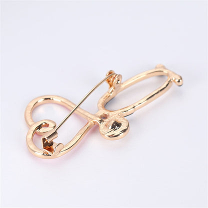 Cubic Zirconia and Enamel 18K Gold-Plated Stethoscope Brooch, gold brooch pin, botanical inspired, side view