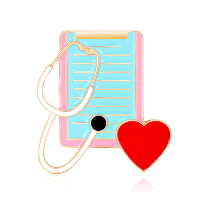 Red Enamel and 18K Gold-Plated Stethoscope Dossier Brooch, gold brooch pin, dainty minimalist design, front view