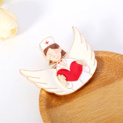 Red Enamel and 18K Gold-Plated Nurse Wing Heart Brooch, gold brooch pin, vintage-inspired design, side view