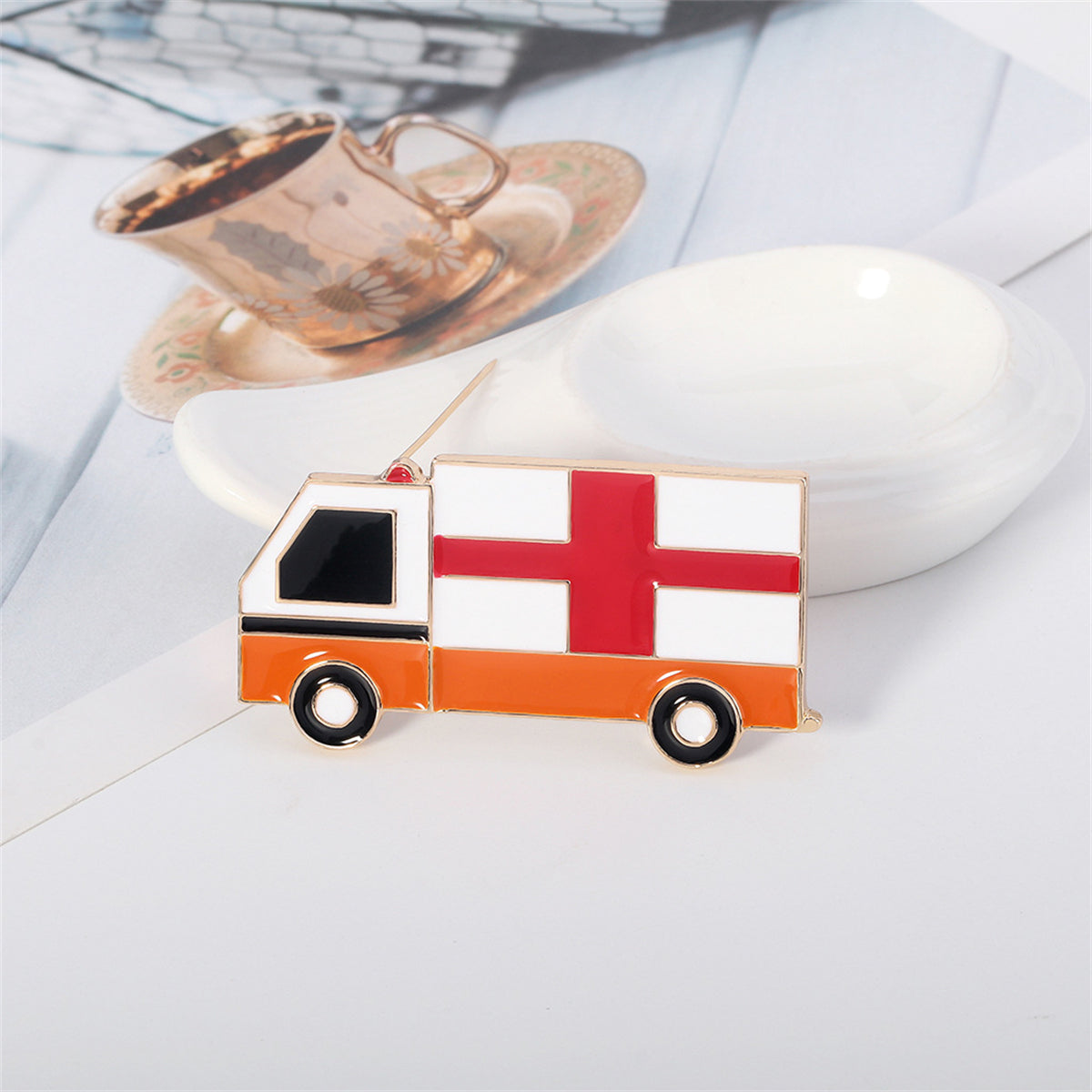 Enamel and 18K Gold-Plated Ambulance Brooch, gold brooch pin, vintage-inspired design, side view