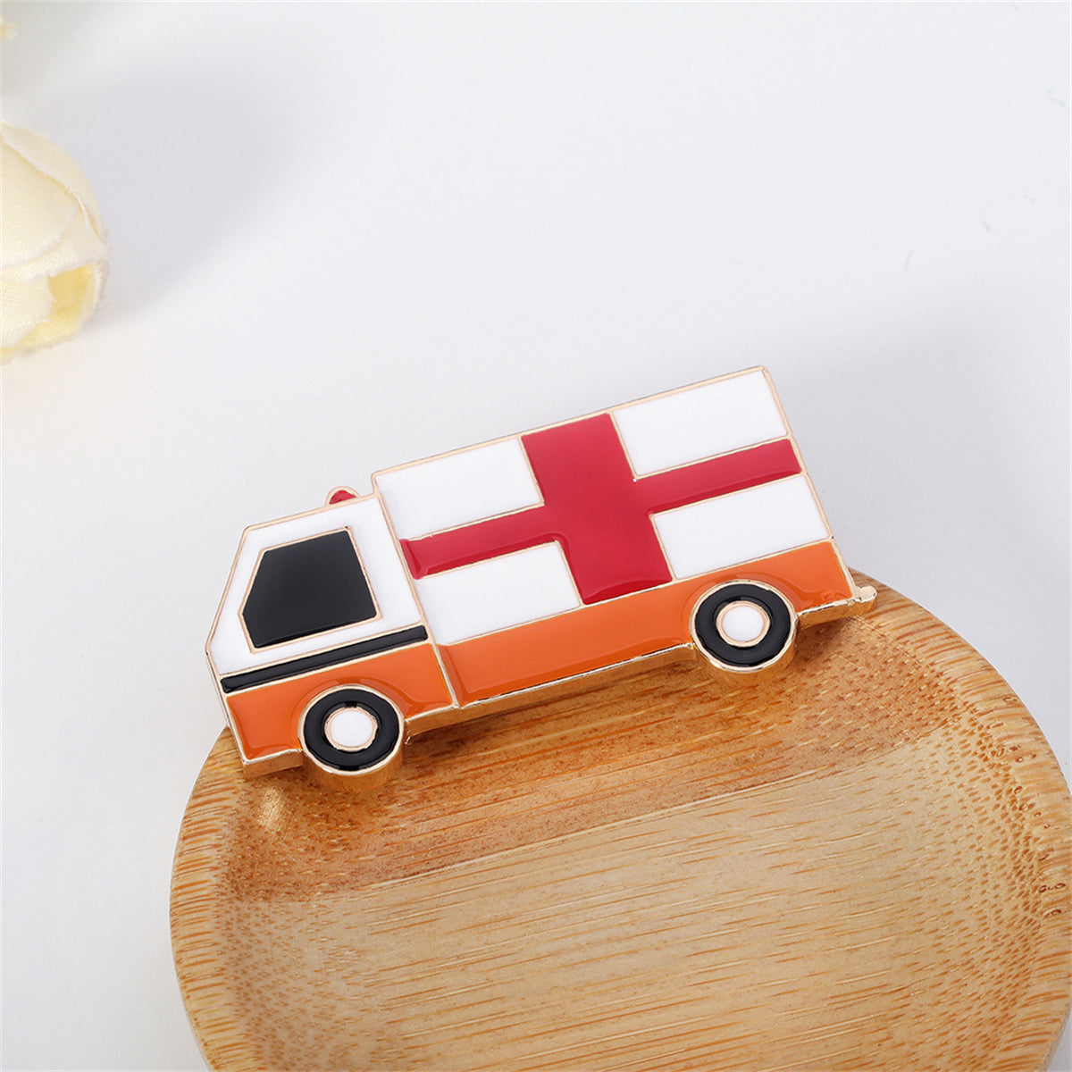 Enamel and 18K Gold-Plated Ambulance Brooch, gold brooch pin, vintage-inspired design, detail close-up