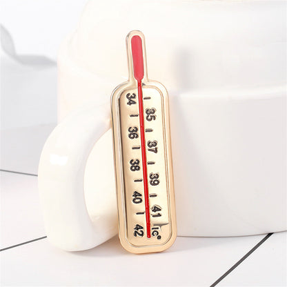 Enamel and 18K Gold-Plated Thermometer Brooch, gold brooch pin, botanical inspired, lifestyle look