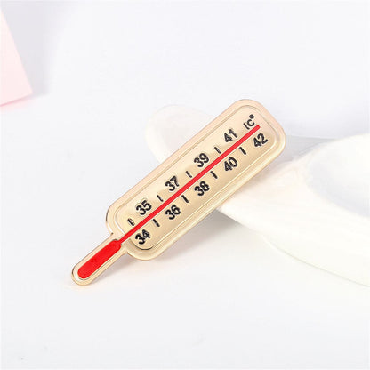 Enamel and 18K Gold-Plated Thermometer Brooch, gold brooch pin, botanical inspired, front view