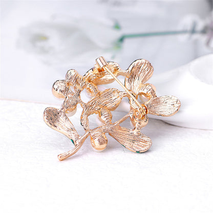 Green Enamel and Pearl 18K Gold-Plated Botanical Brooch, gold brooch pin, vintage-inspired design, styled look