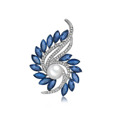 A stunning blue and white pearl and diamond brooch featuring navy crystals and cubic zirconia in a botanical design.