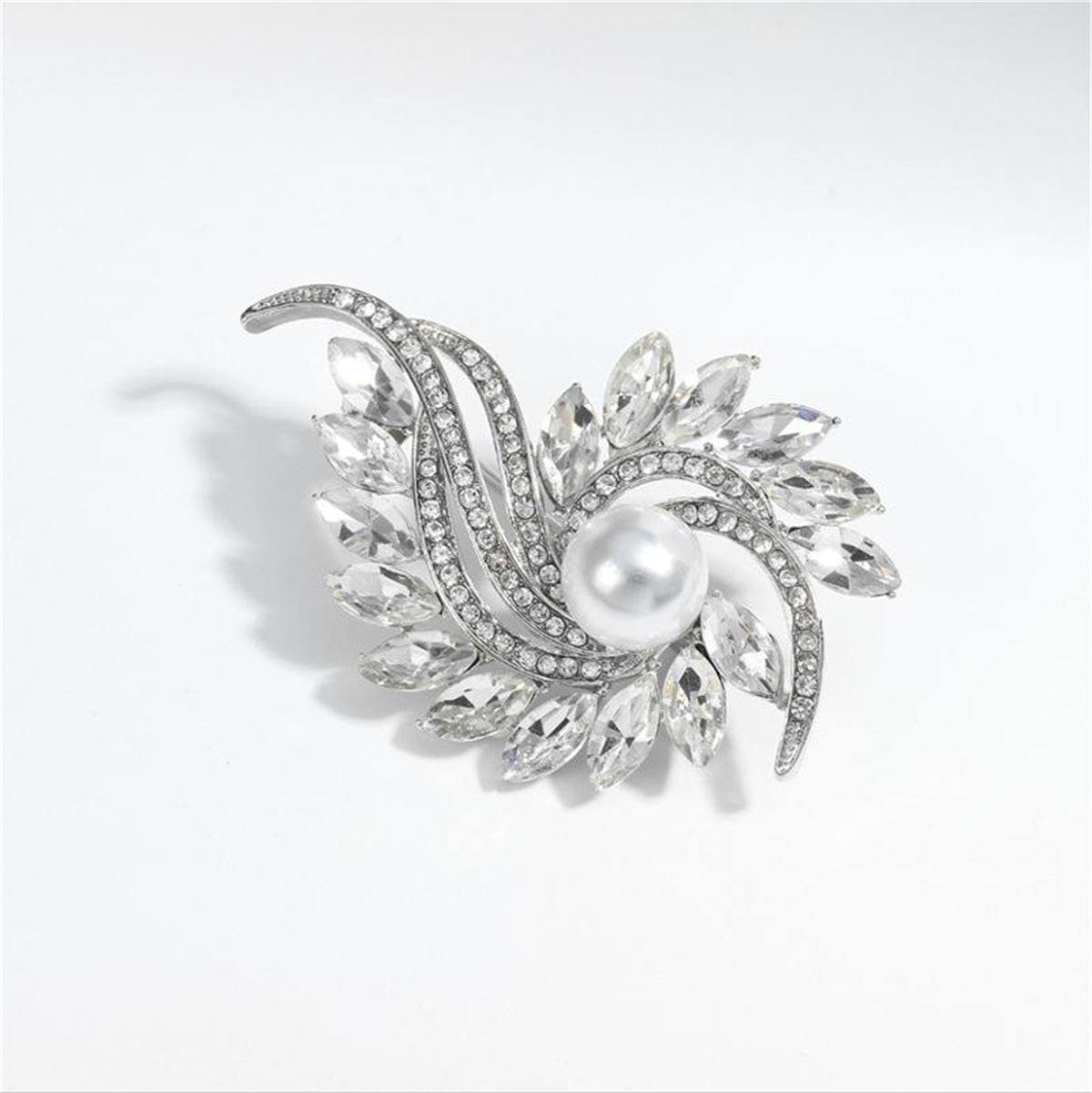 A refined white pearl and diamond brooch, enhanced with clear crystal and cubic zirconia, reflecting a botanical theme.