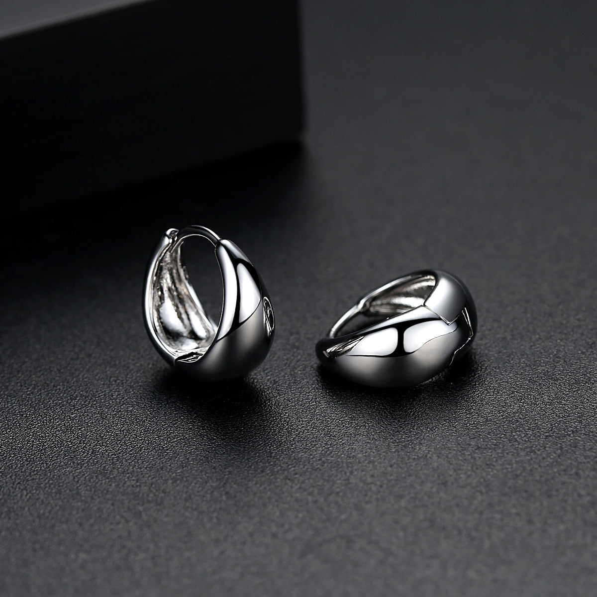 Silver-Plated Oval Huggie Earrings, silver huggie earrings, dainty minimalist design, side view