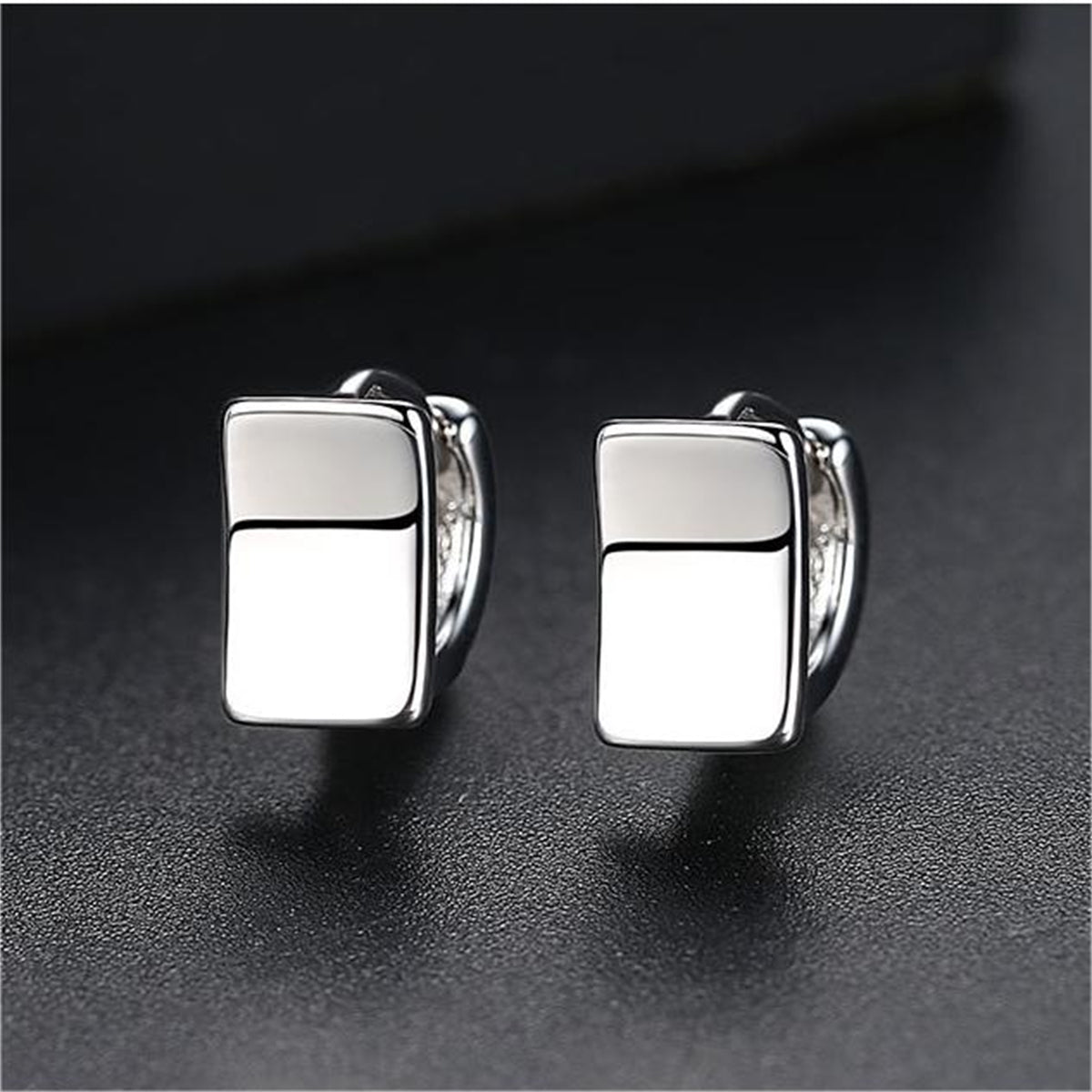Silver-Plated Curved Rectangle Face Huggie Earrings, silver huggie earrings, botanical inspired, front view