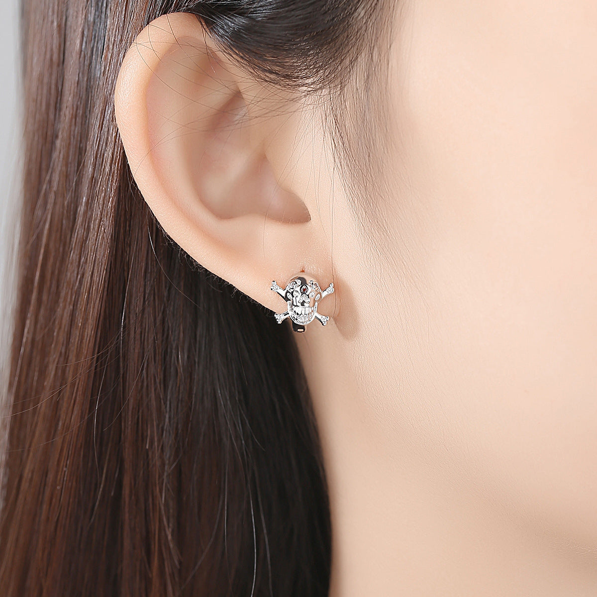 Cubic Zirconia and Silver-Plated Skull Huggie Earrings, silver huggie earrings, everyday style, detail close-up