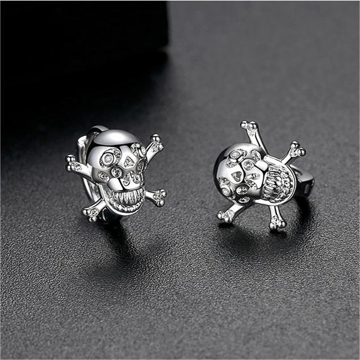 Cubic Zirconia and Silver-Plated Skull Huggie Earrings, silver huggie earrings, everyday style, side view
