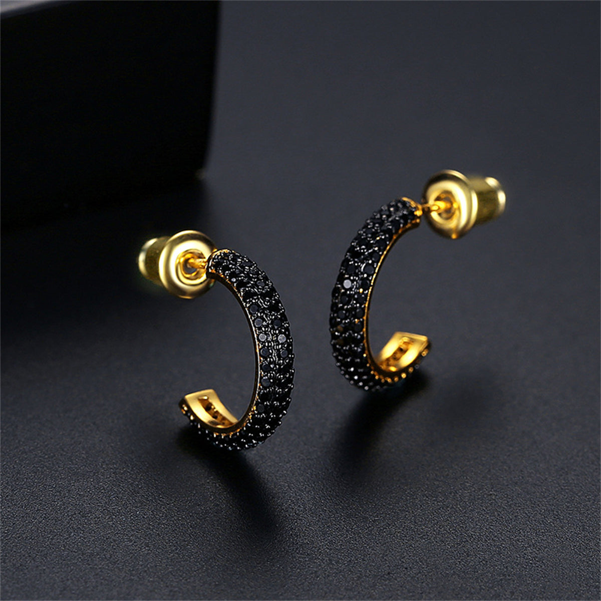 Black Cubic Zirconia and 18K Gold-Plated Huggie Earrings, gold huggie earrings, vintage-inspired design, front view