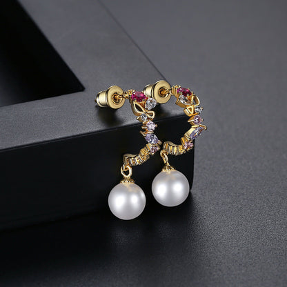 Cubic Zirconia and Pearl 18K Gold-Plated Butterfly Huggie Earrings, gold huggie earrings, vintage-inspired design, side view