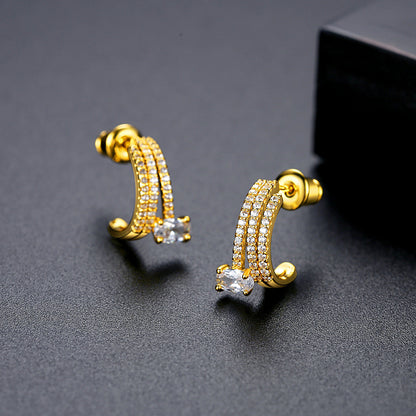 Crystal and 18K Gold-Plated Cubic Zirconia-Accent Layered Huggie Earrings, gold huggie earrings, everyday style, front view