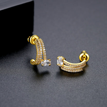 Crystal and 18K Gold-Plated Cubic Zirconia-Accent Layered Huggie Earrings, gold huggie earrings, detail close-up