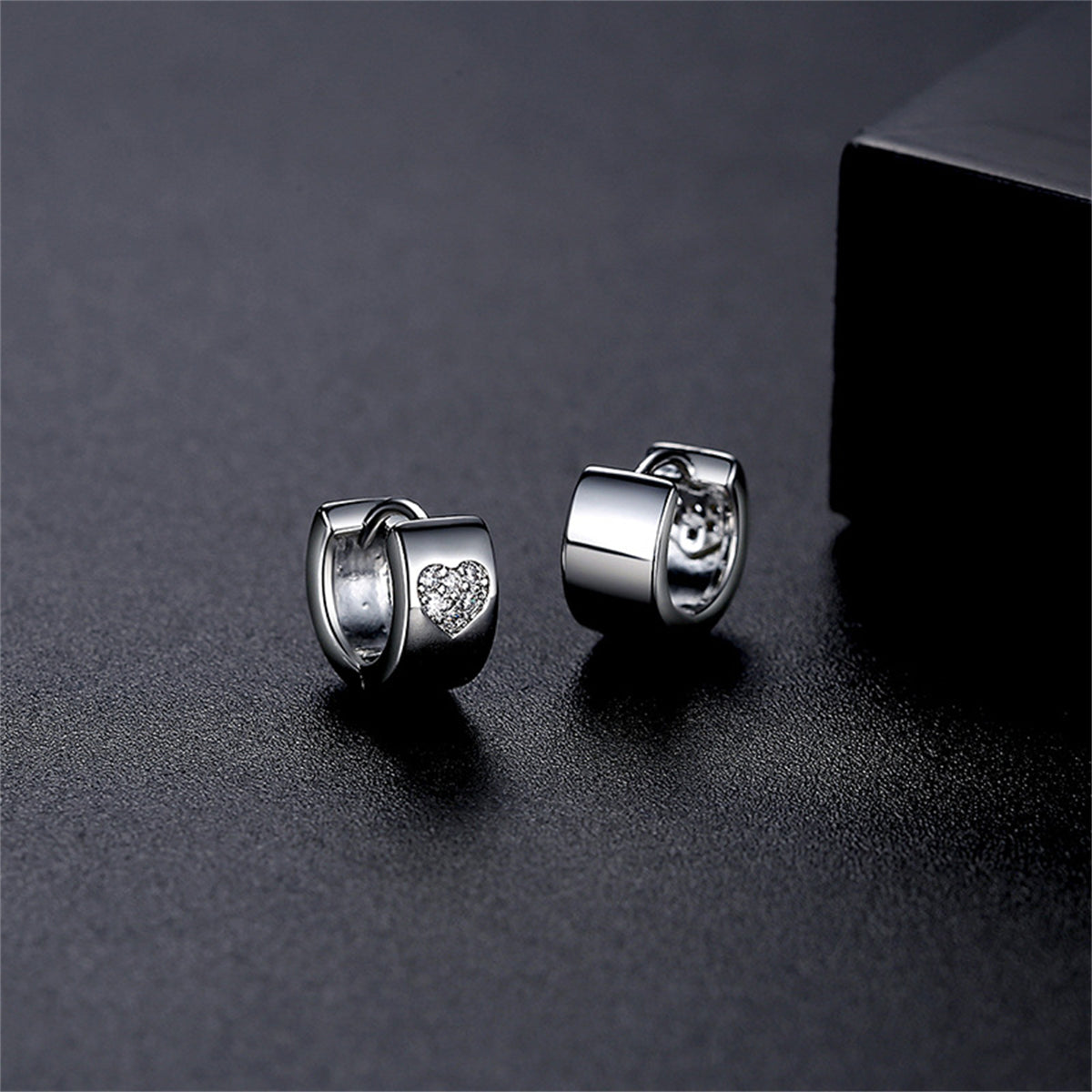 Cubic Zirconia and Silver-Plated Hearts Huggie Earrings, silver huggie earrings, dainty minimalist design, front view