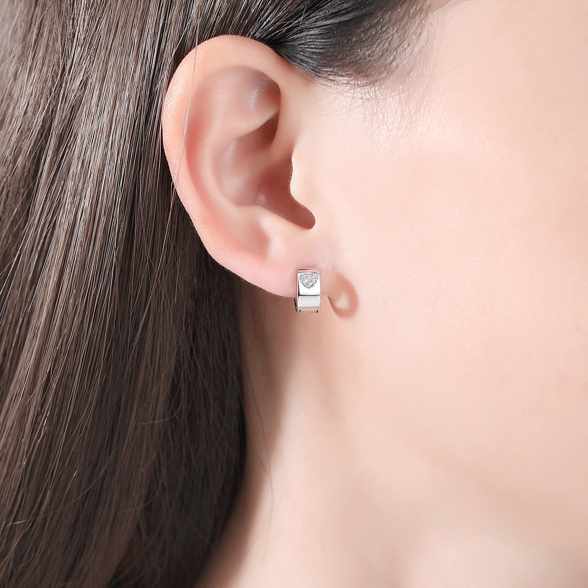 Cubic Zirconia and Silver-Plated Hearts Huggie Earrings, silver huggie earrings, dainty minimalist design, side view