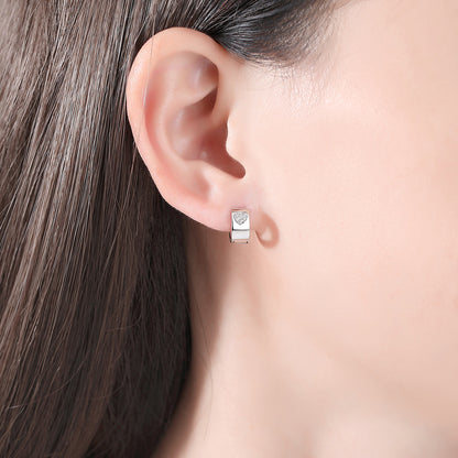 Cubic Zirconia and Silver-Plated Hearts Huggie Earrings, silver huggie earrings, dainty minimalist design, side view