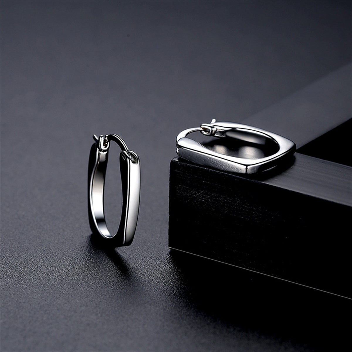 Silver-Plated U-Shape Huggie Earrings, silver huggie earrings, botanical inspired, front view