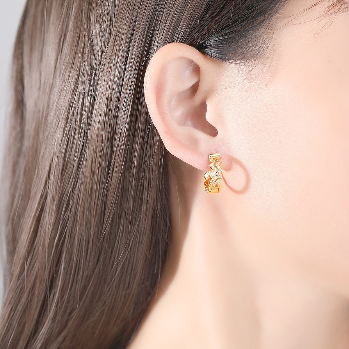Cubic Zirconia and 18K Gold-Plated Layered Wave Huggie Earrings, gold huggie earrings, botanical inspired, detail close-up