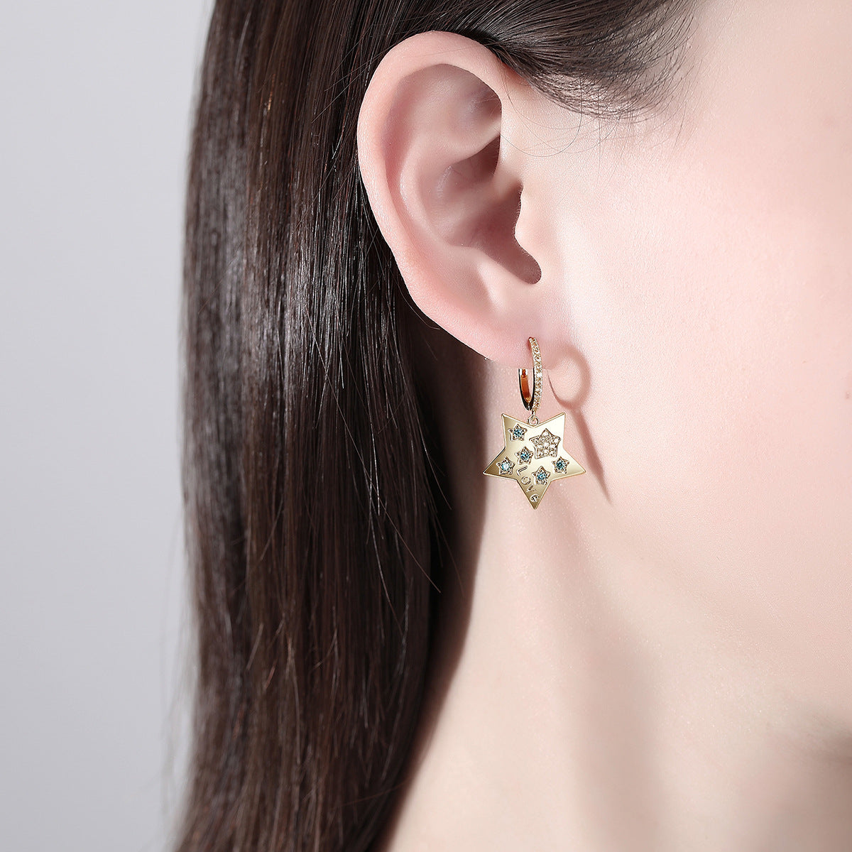 Blue Cubic Zirconia and 18K Gold-Plated Star Huggie Earrings, gold huggie earrings, vintage-inspired design, lifestyle look