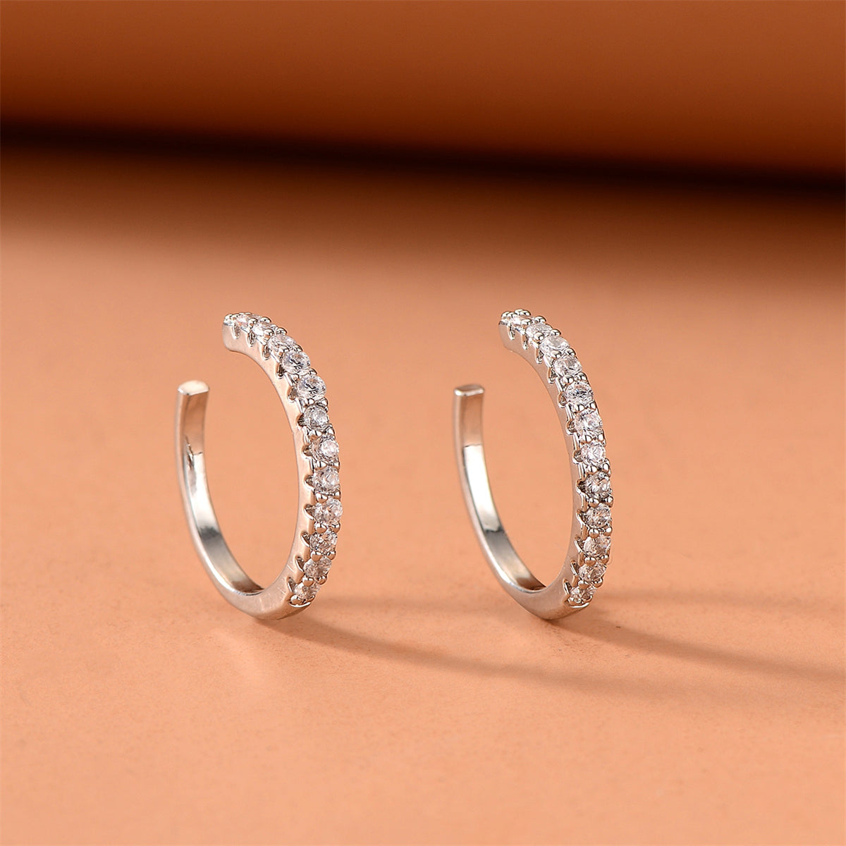 Cubic Zirconia and Silver-Plated Pav¨¦ Ear Cuffs, silver stud earrings for women, botanical inspired, front view