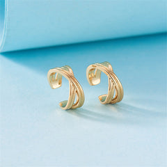Elegant 18K gold-plated hoop earrings featuring three stacked rings for a chic and modern look.