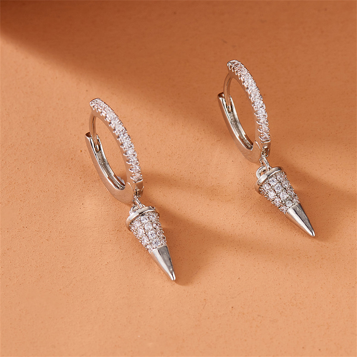Cubic Zirconia and Silver-Plated Awl Huggie Earring, silver huggie earrings, vintage-inspired design, styled look
