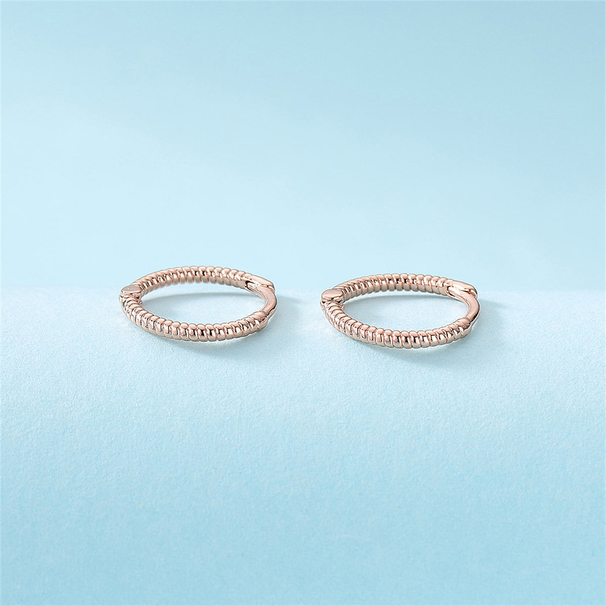 18K Rose Gold-Plated Textured Huggie Earrings, rose gold huggie earrings, vintage-inspired design, lifestyle look