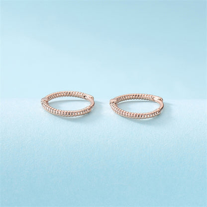 18K Rose Gold-Plated Textured Huggie Earrings, rose gold huggie earrings, vintage-inspired design, lifestyle look