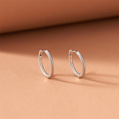 Silver-Plated Twine Huggie Earrings, silver huggie earrings, vintage-inspired design, side view