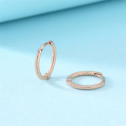 18K Rose Gold-Plated Textured Huggie Earrings, rose gold huggie earrings, vintage-inspired design, detail close-up