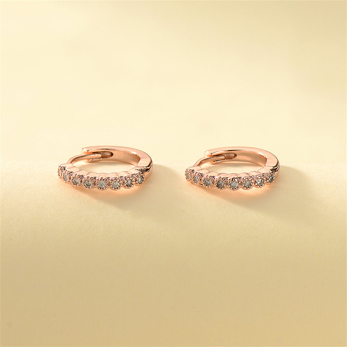 Cubic Zirconia and 18K Rose Gold-Plated Bezel Huggie Earrings, rose gold huggie earrings, everyday style, side view