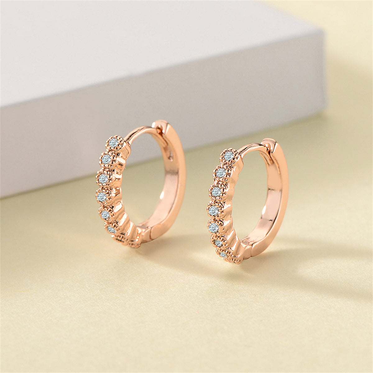 Cubic Zirconia and 18K Rose Gold-Plated Bezel Huggie Earrings, rose gold huggie earrings, everyday style, front view