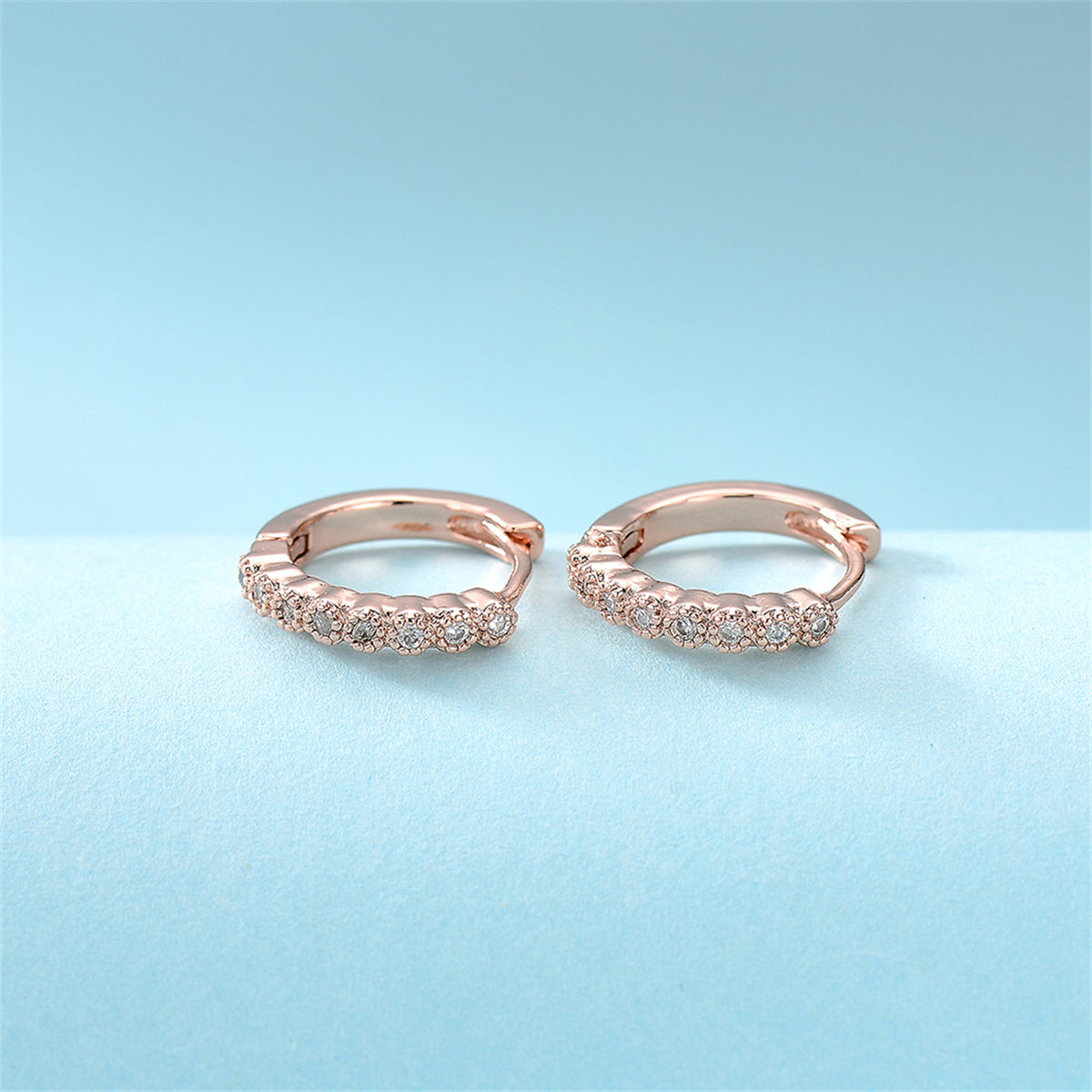 Cubic Zirconia and 18K Rose Gold-Plated Bezel Huggie Earrings, rose gold huggie earrings, everyday style, lifestyle look
