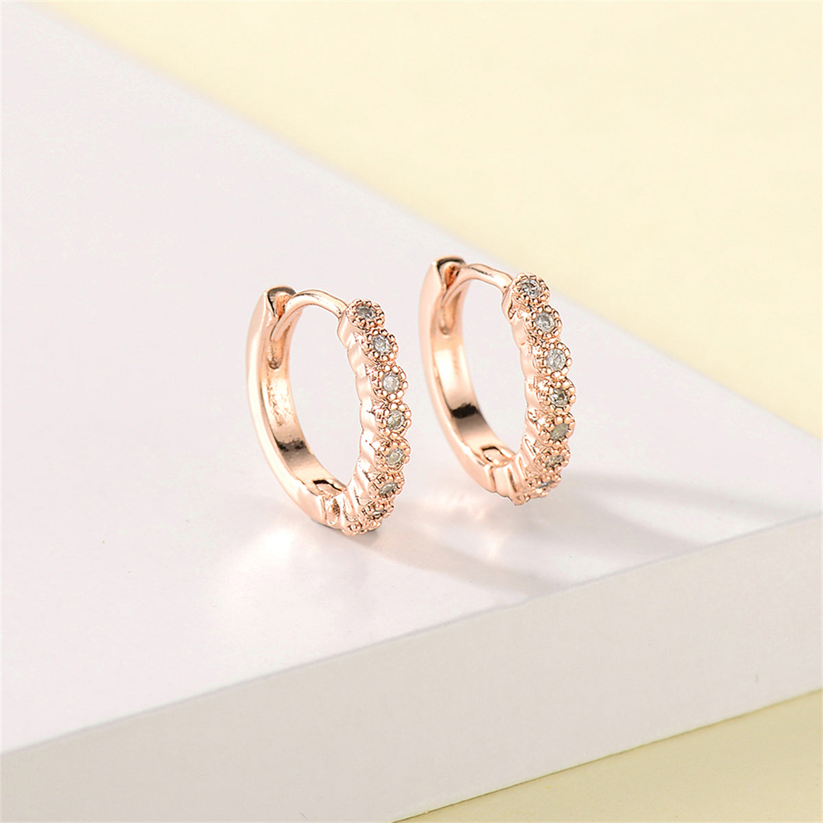 Cubic Zirconia and 18K Rose Gold-Plated Bezel Huggie Earrings, rose gold huggie earrings, everyday style, styled look