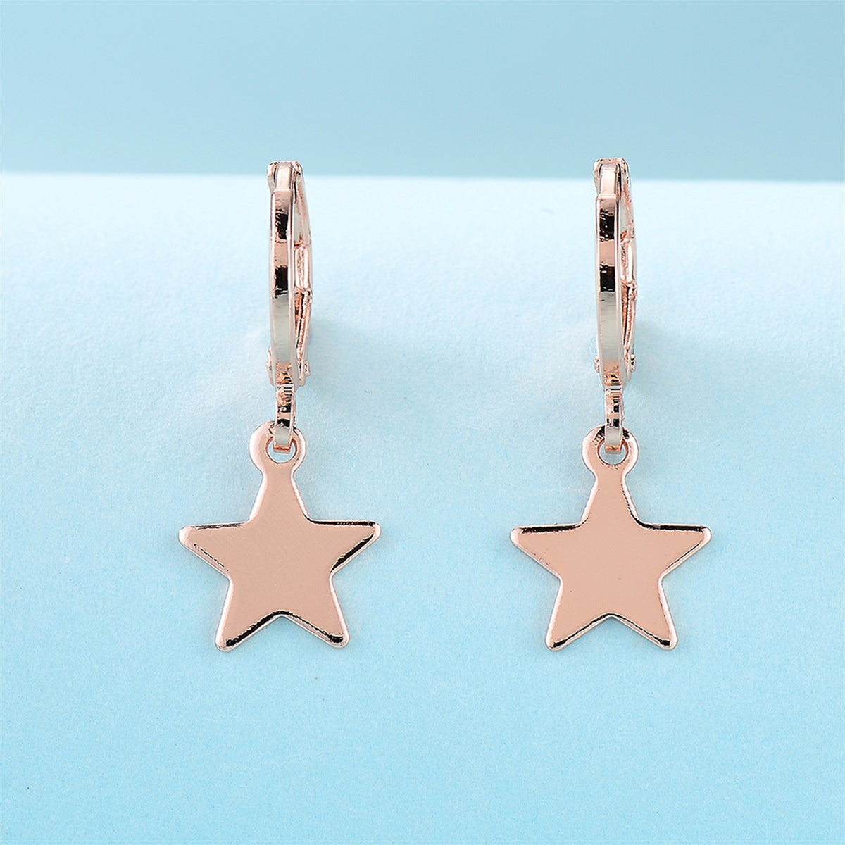 18K Rose Gold-Plated Star Huggie Earrings, rose gold huggie earrings, vintage-inspired design, side view