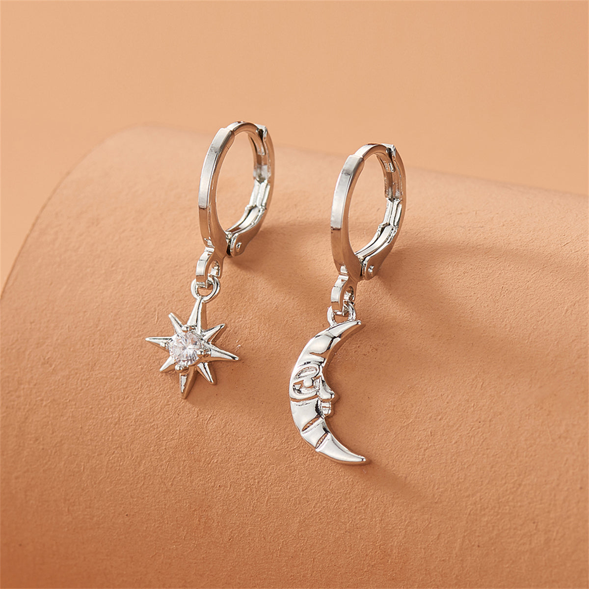 Cubic Zirconia and Silver-Plated Sun and Moon Asymmetrical Huggie Earrings, silver huggie earrings, side view